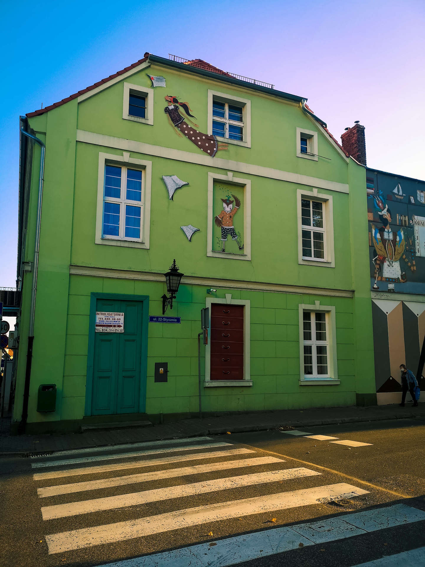 Building with book mural in Chelmno